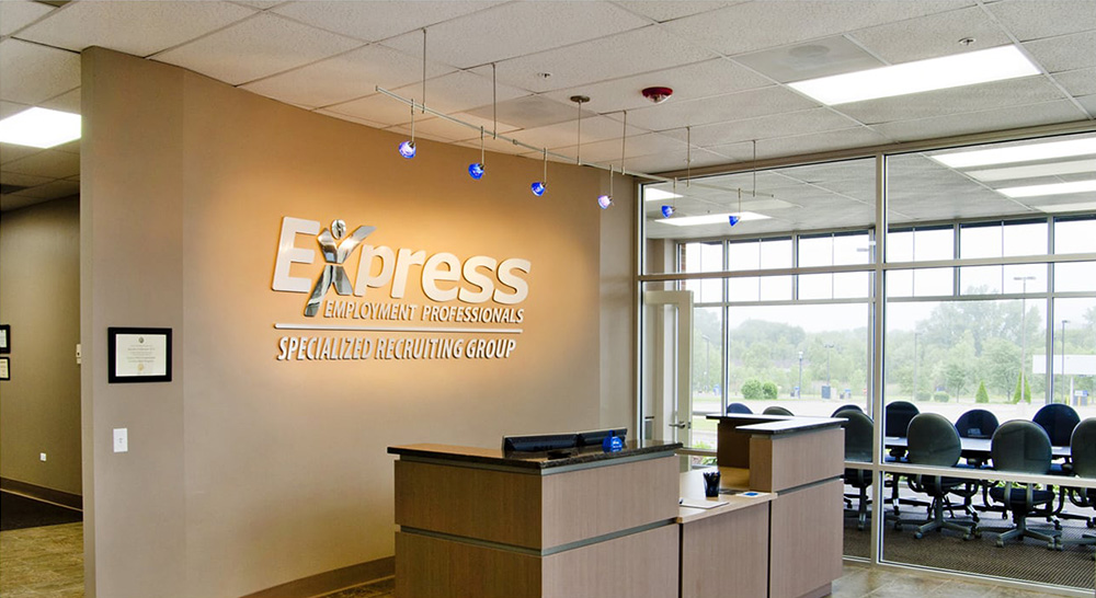 Interior image of a front desk in an Express office